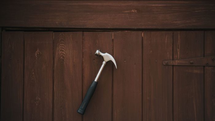 A carpentry hammer with a slightly rounded